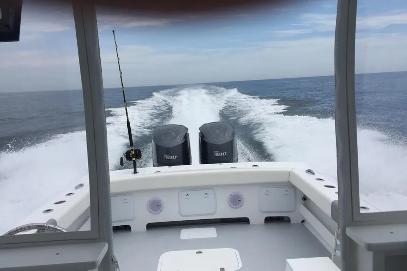  Yacht Photos Pics 2020 Steiger Craft 31 Miami boat cruising on open water, twin engines visible.