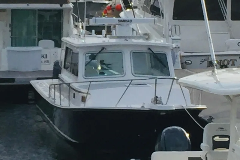  Yacht Photos Pics 2020 Steiger Craft 31 Miami boat docked among other vessels.