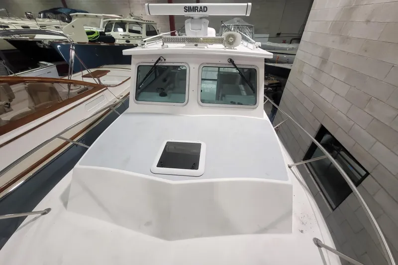  Yacht Photos Pics 2020 Steiger Craft 31 Miami boat in indoor storage, featuring a Simrad radar.