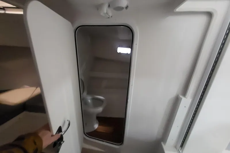  Yacht Photos Pics 2020 Steiger Craft 31 Miami boat interior with compact bathroom and toilet.