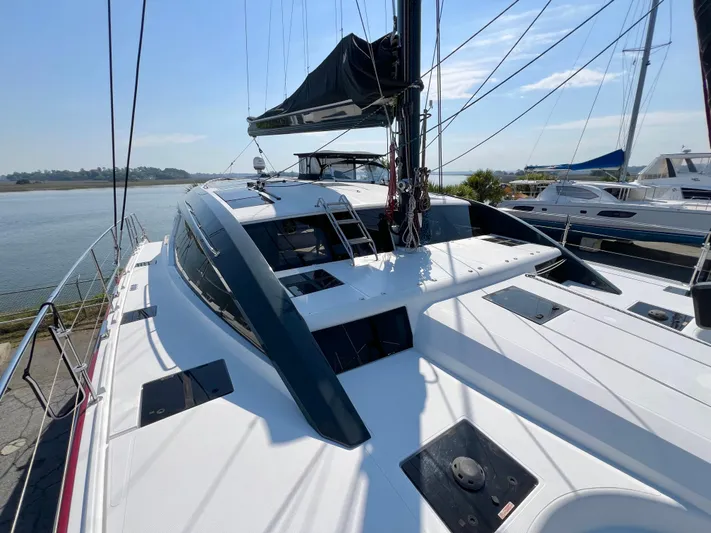 Rogue Yacht Photos Pics Luxury Privilege 510 yacht docked, showcasing sleek design and modern features, 2021 model.