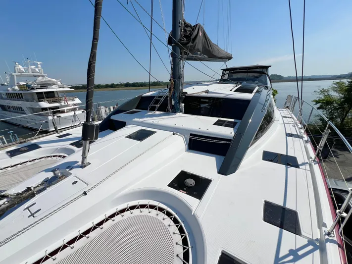 Rogue Yacht Photos Pics Luxury Privilege 510 yacht docked, showcasing sleek design and spacious deck, 2021 model.