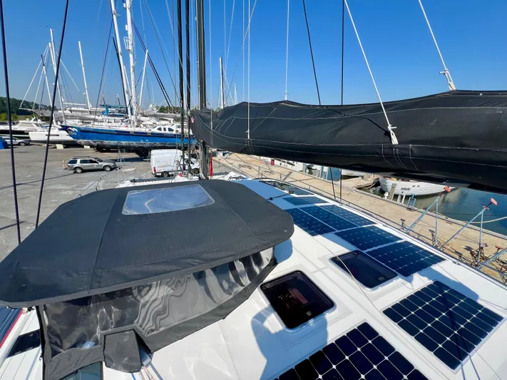 Rogue Yacht Photos Pics Sailing yacht Privilege 510, 2021 model, with solar panels and docked at a marina.