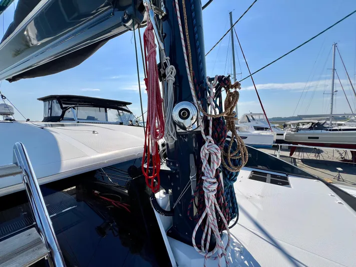 Rogue Yacht Photos Pics Sailing yacht Privilege 510, 2021 model, with ropes and mast in a marina setting.