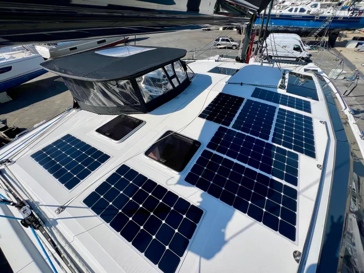 Rogue Yacht Photos Pics Sailboat deck with solar panels, Privilege 510, 2021 model, docked at marina.