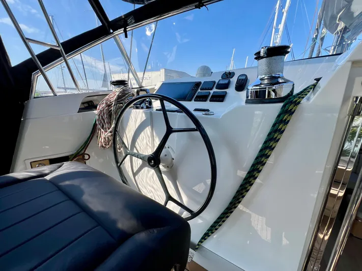 Rogue Yacht Photos Pics Helm of 2021 Privilege 510 yacht with steering wheel and navigation controls.