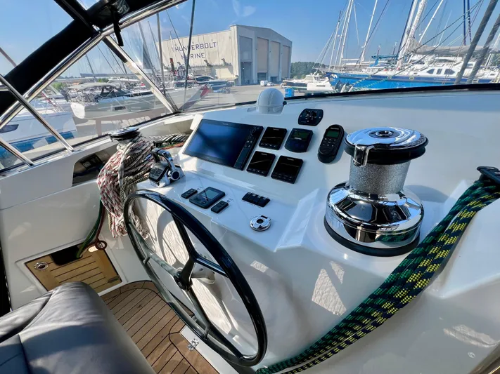 Rogue Yacht Photos Pics Helm of 2021 Privilege 510 yacht with navigation controls and marina view.