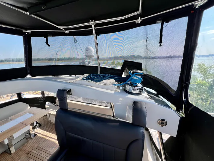 Rogue Yacht Photos Pics Interior view of 2021 Privilege 510 yacht with seating and navigation equipment.