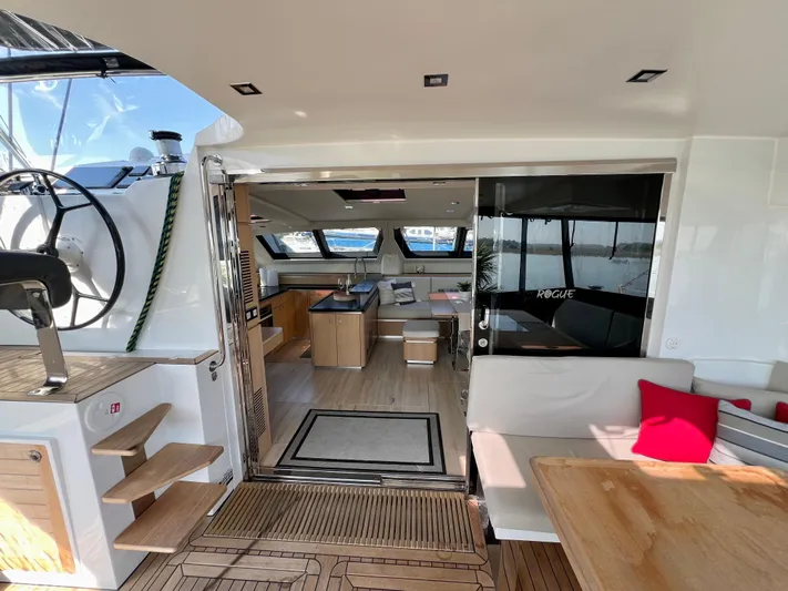 Rogue Yacht Photos Pics Luxurious interior of 2021 Privilege 510 yacht with modern kitchen and seating area.