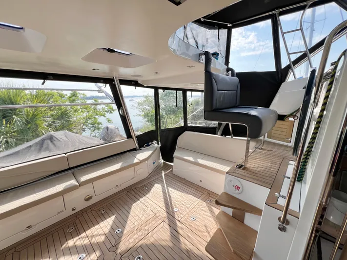 Rogue Yacht Photos Pics Luxurious interior of 2021 Privilege 510 yacht with modern seating and wooden flooring.
