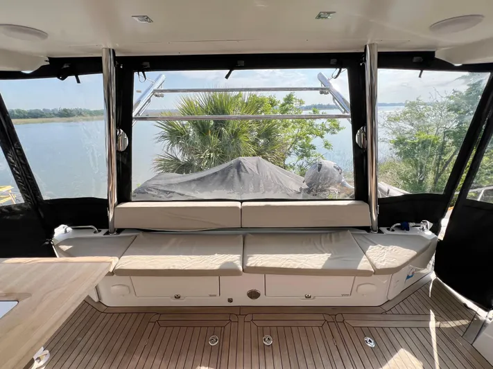 Rogue Yacht Photos Pics Interior view of 2021 Privilege 510 yacht with seating and scenic water view.