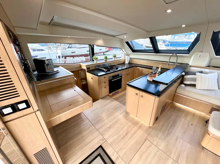 Rogue Yacht Photos Pics Luxurious 2021 Privilege 510 yacht interior with modern kitchen and seating area.