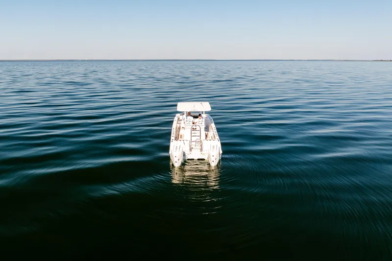 Endless Bs Yacht Photos Pics 2023 Twin Vee 260 GFX CC boat on calm open water, aerial view.