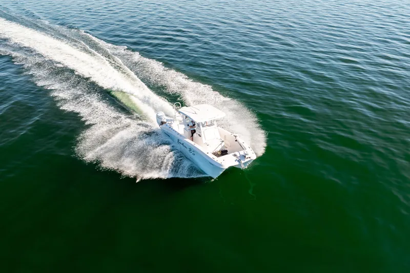 Endless Bs Yacht Photos Pics 2023 Twin Vee 260 GFX CC boat cruising on open water, creating a wake.