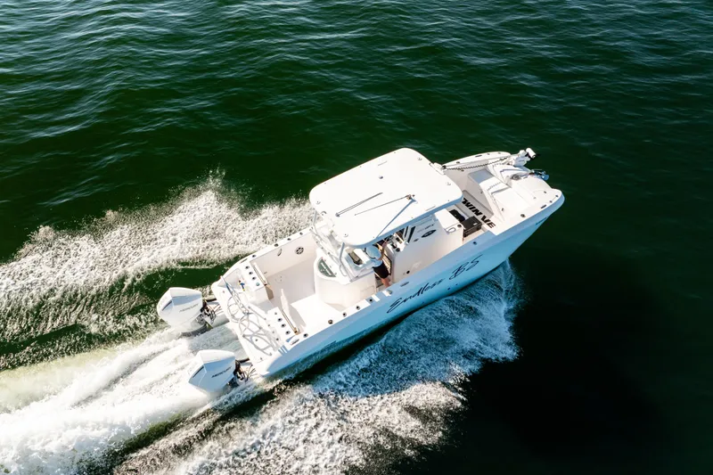 Endless Bs Yacht Photos Pics 2023 Twin Vee 260 GFX CC boat cruising on open water, aerial view.