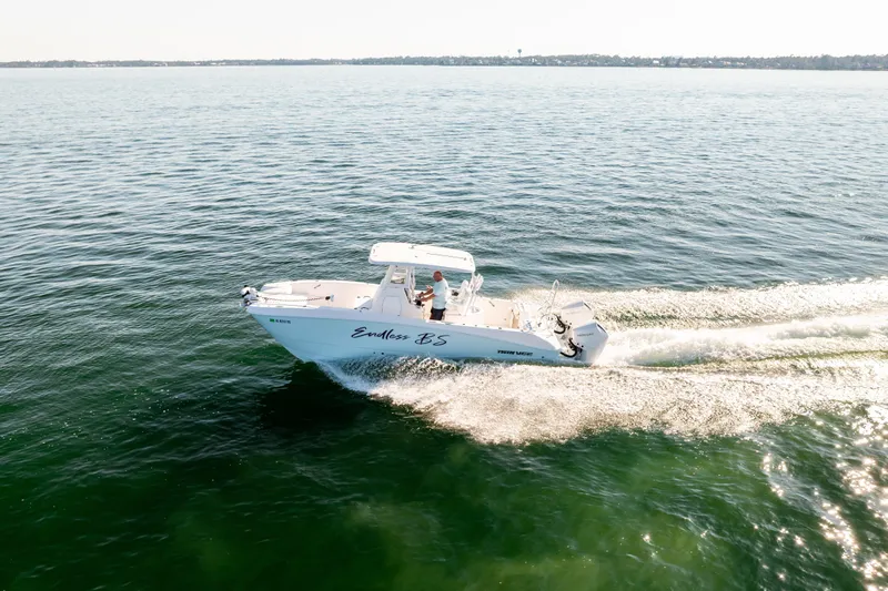 Endless Bs Yacht Photos Pics 2023 Twin Vee 260 GFX CC boat cruising on open water.
