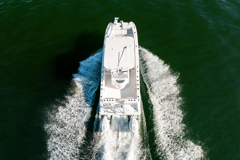 Endless Bs Yacht Photos Pics 2023 Twin Vee 260 GFX CC boat cruising on open water, aerial view.