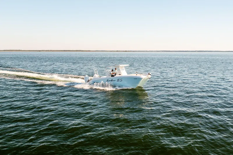 Endless Bs Yacht Photos Pics 2023 Twin Vee 260 GFX CC cruising on open water under clear skies.