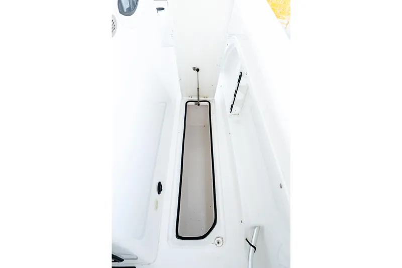 Endless Bs Yacht Photos Pics 2023 Twin Vee 260 GFX CC boat interior storage compartment, white finish.