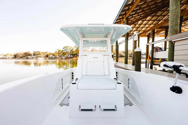Endless Bs Yacht Photos Pics 2023 Twin Vee 260 GFX CC boat docked, showcasing sleek design and spacious seating.