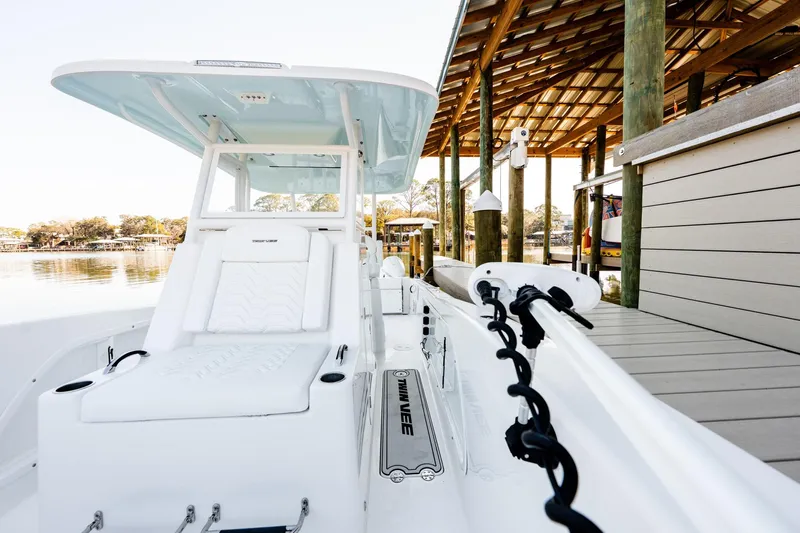 Endless Bs Yacht Photos Pics 2023 Twin Vee 260 GFX CC boat docked, showcasing sleek design and comfortable seating.