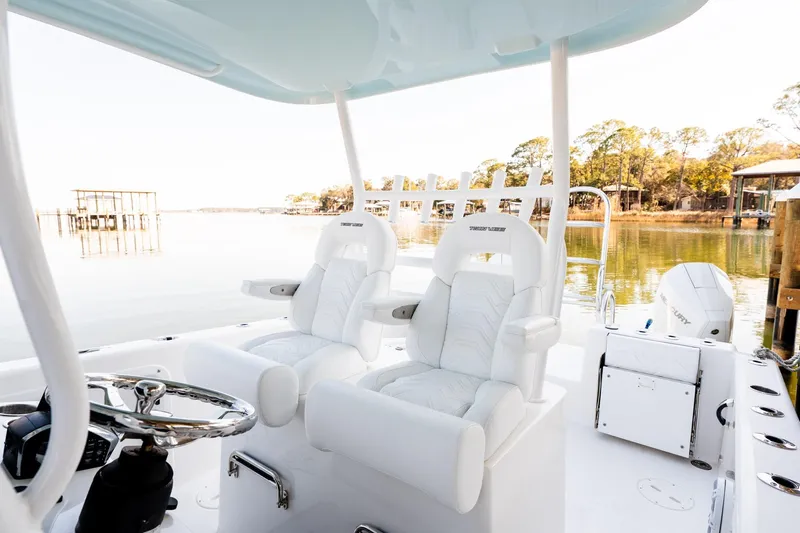 Endless Bs Yacht Photos Pics 2023 Twin Vee 260 GFX CC boat interior with white seating and steering wheel.