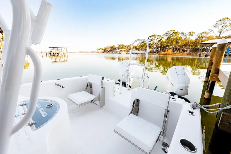 Endless Bs Yacht Photos Pics 2023 Twin Vee 260 GFX CC boat interior with serene waterfront view.