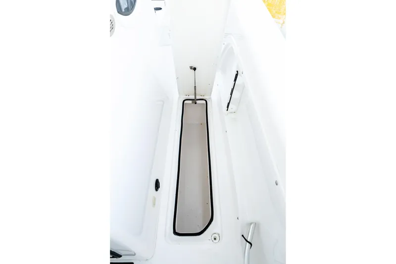 Endless Bs Yacht Photos Pics 2023 Twin Vee 260 GFX CC boat interior storage compartment, white and spacious design.