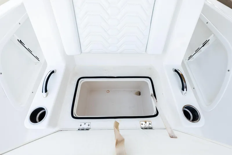 Endless Bs Yacht Photos Pics 2023 Twin Vee 260 GFX CC boat interior with storage compartment and cup holders.