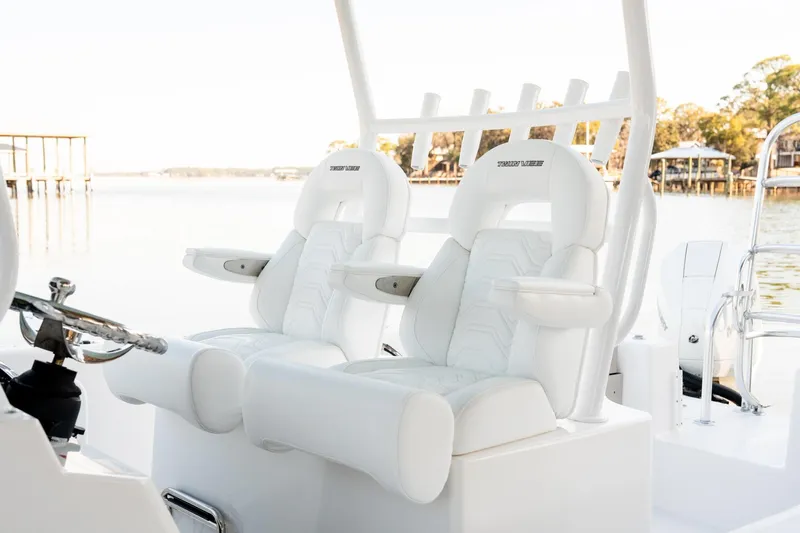 Endless Bs Yacht Photos Pics 2023 Twin Vee 260 GFX CC boat with luxurious white seating and scenic waterfront view.