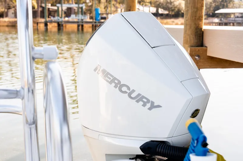 Endless Bs Yacht Photos Pics 2023 Twin Vee 260 GFX CC with Mercury outboard engine by a dock.