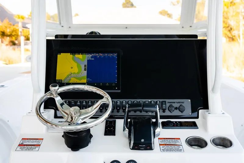 Endless Bs Yacht Photos Pics 2023 Twin Vee 260 GFX CC boat dashboard with steering wheel and navigation display.