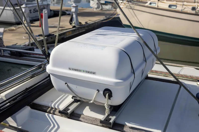 Atlas Yacht Photos Pics Life raft on Jeanneau Sun Odyssey 43 DS, 2001 model, docked at marina.