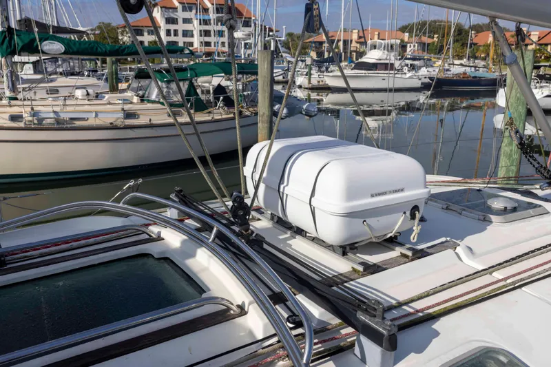 Atlas Yacht Photos Pics 2001 Jeanneau Sun Odyssey 43 DS sailboat docked in a marina, surrounded by other boats.