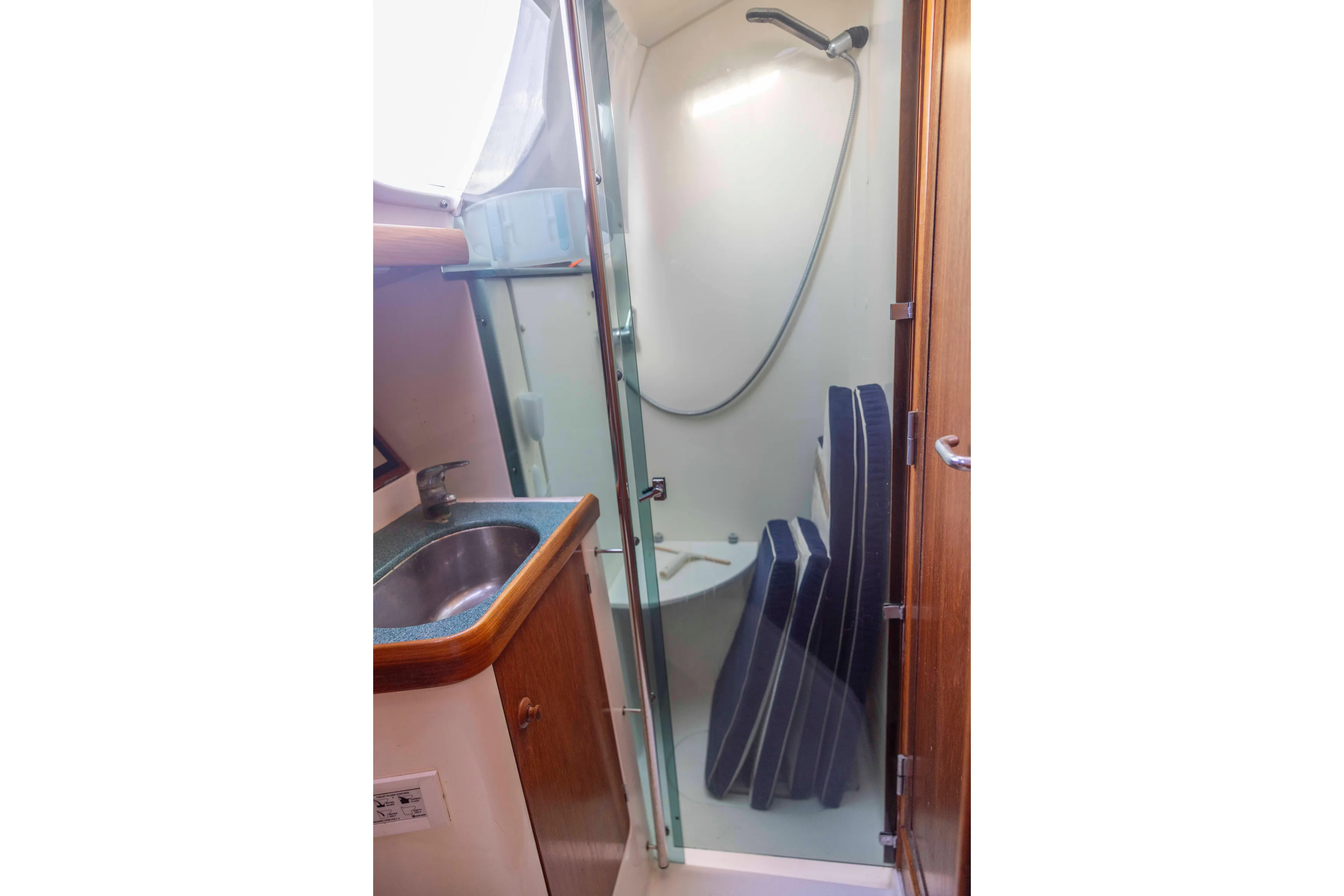Atlas Yacht Photos Pics Bathroom interior of 2001 Jeanneau Sun Odyssey 43 DS yacht with shower and sink.