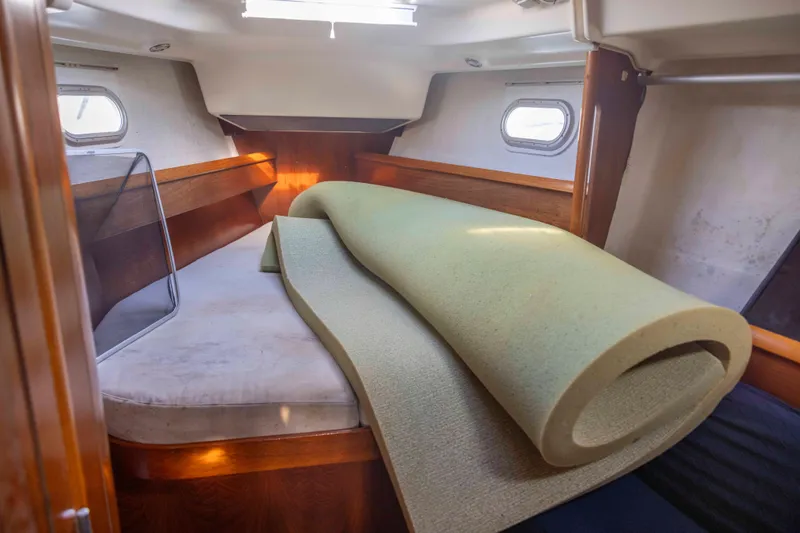 Atlas Yacht Photos Pics 2001 Jeanneau Sun Odyssey 43 DS cabin interior with rolled mattress.