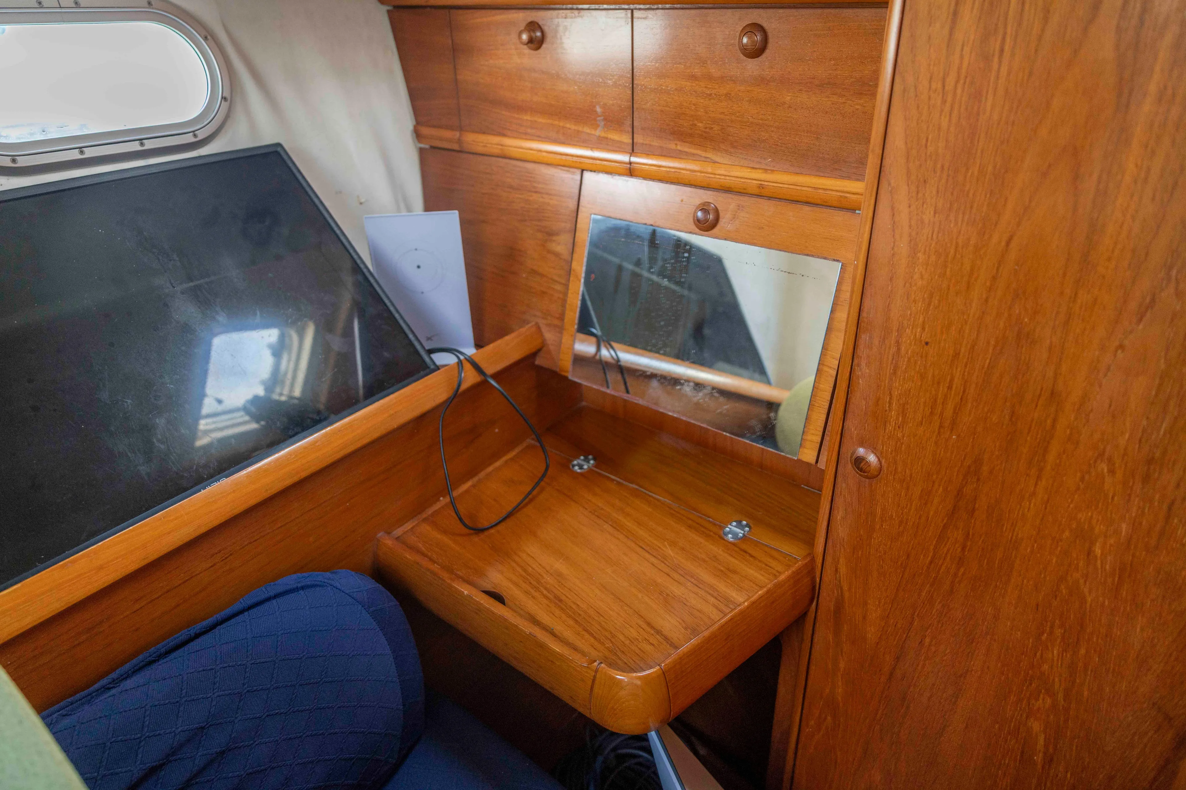 Atlas Yacht Photos Pics Interior of 2001 Jeanneau Sun Odyssey 43 DS with wooden cabinetry and mirror.
