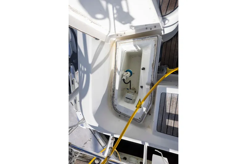 Atlas Yacht Photos Pics Jeanneau Sun Odyssey 43 DS 2001 yacht deck with open storage compartment.