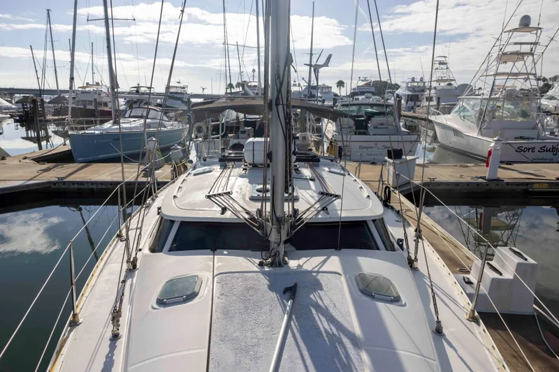 Atlas Yacht Photos Pics Jeanneau Sun Odyssey 43 DS 2001 sailboat docked in a marina, surrounded by other boats.