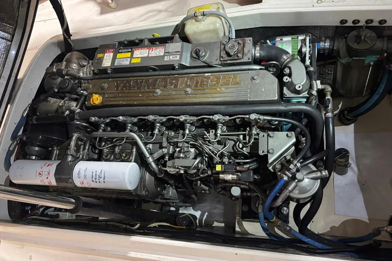 Manitou Yacht Photos Pics Engine of a 2004 Hinckley 36 Picnic Boat EP, showcasing Yanmar diesel components.