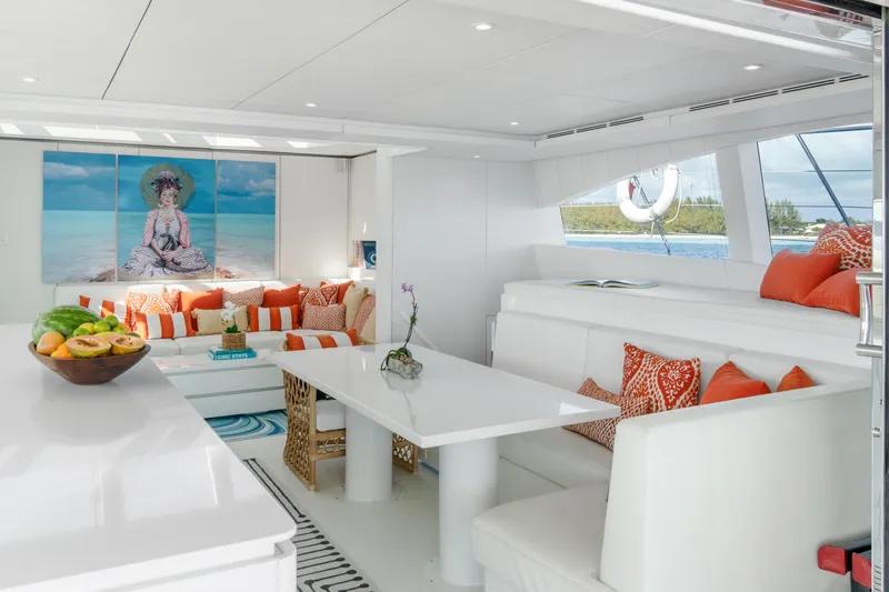 Royal Rita Yacht Photos Pics Luxurious Sunreef 70 yacht interior with modern white and orange decor, 2016 model.