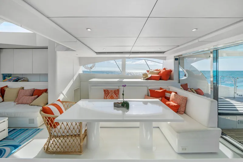 Royal Rita Yacht Photos Pics Luxurious interior of 2016 Sunreef 70 yacht with modern seating and ocean view.