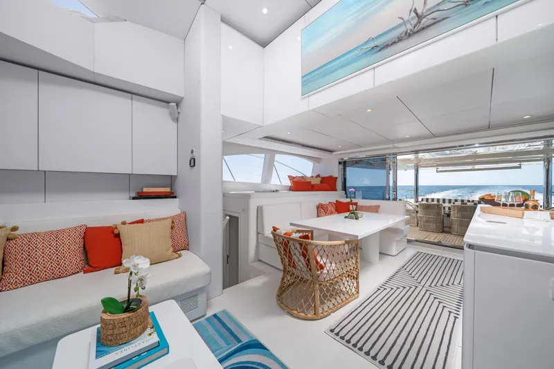 Royal Rita Yacht Photos Pics Luxurious interior of 2016 Sunreef 70 yacht with modern decor and ocean view.