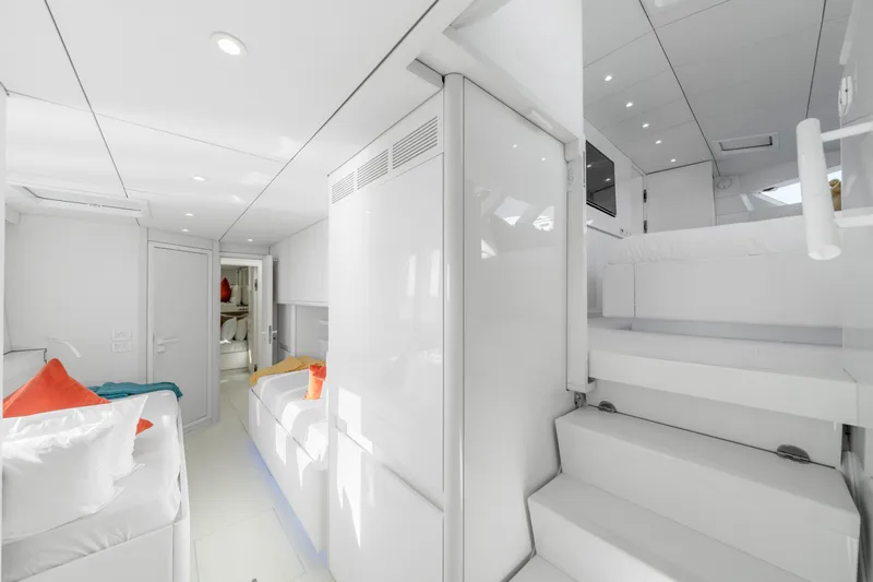 Royal Rita Yacht Photos Pics Luxurious interior of 2016 Sunreef 70 yacht with modern white design and colorful accents.