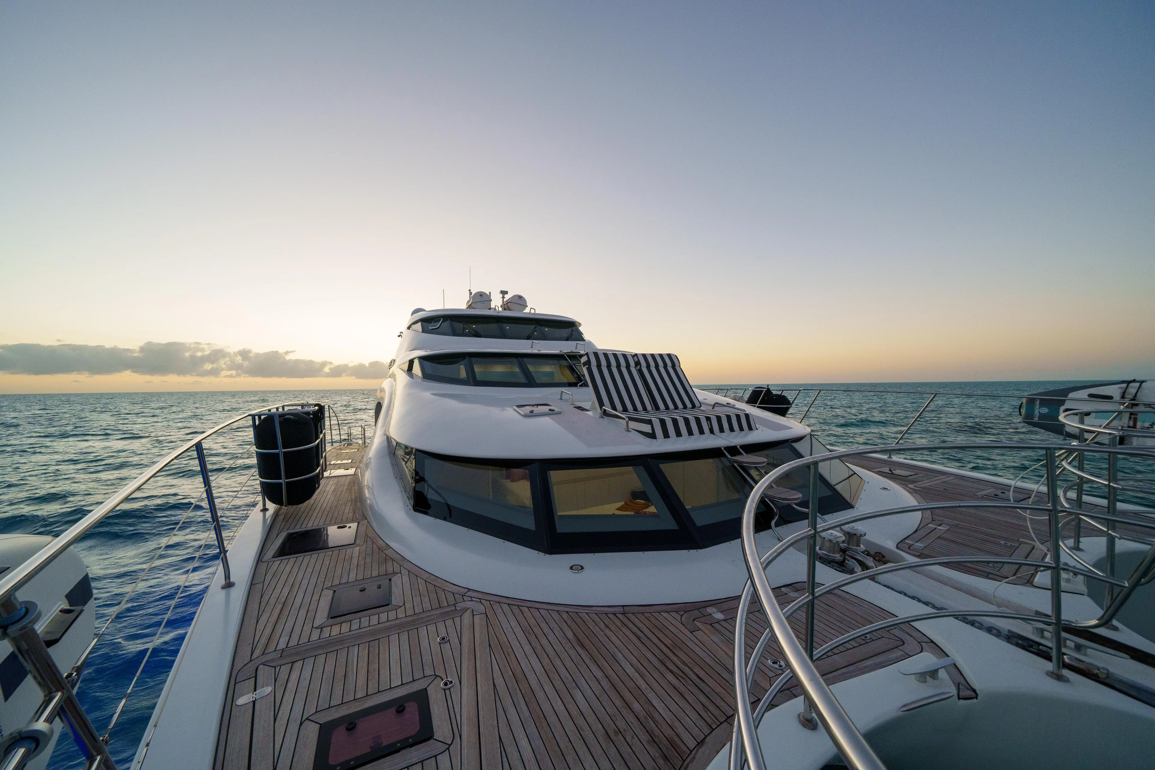 Royal Rita Yacht Photos Pics Luxurious 2016 Sunreef 70 yacht cruising at sunset on open sea.