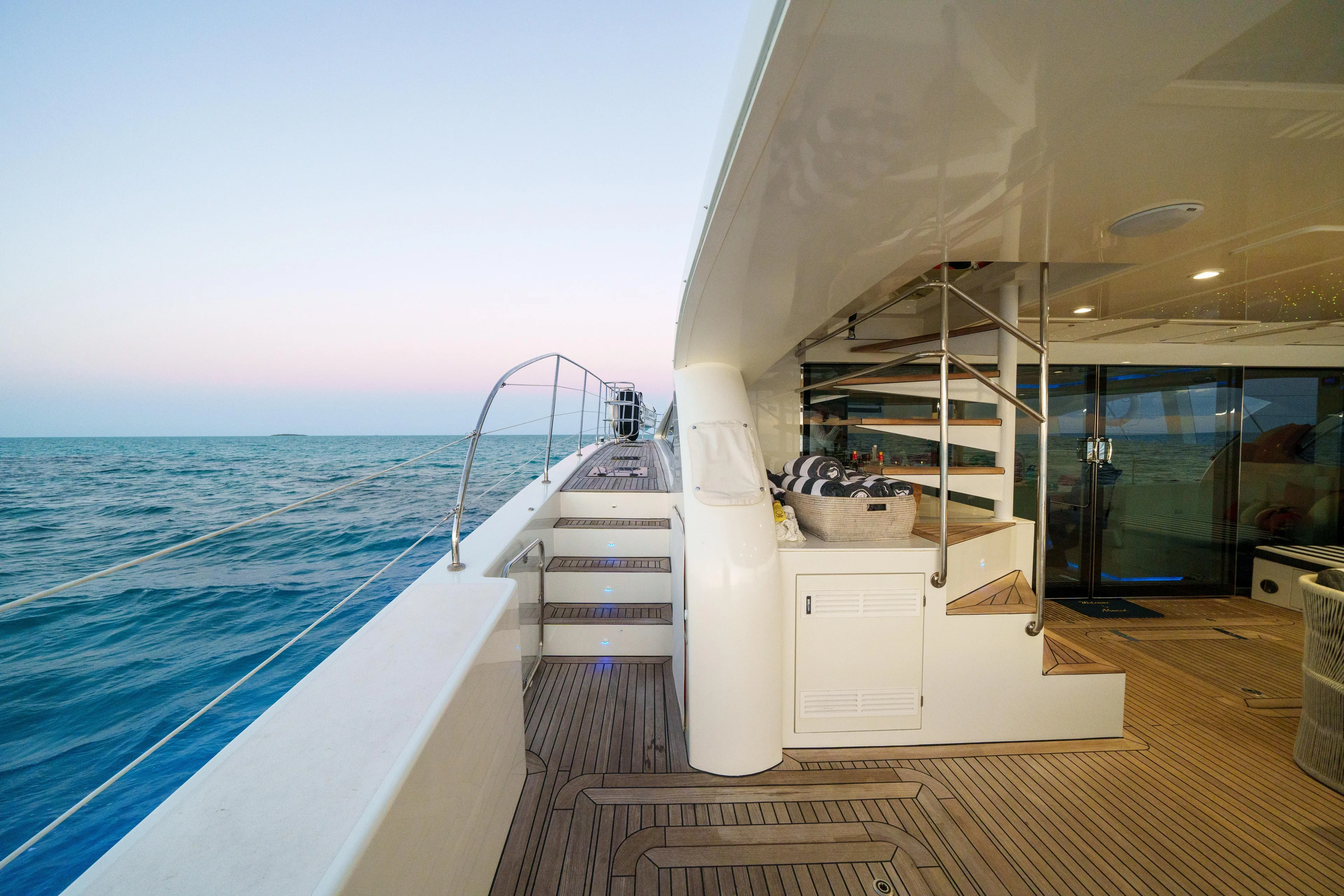 Royal Rita Yacht Photos Pics Luxurious 2016 Sunreef 70 yacht deck with ocean view and elegant staircase.