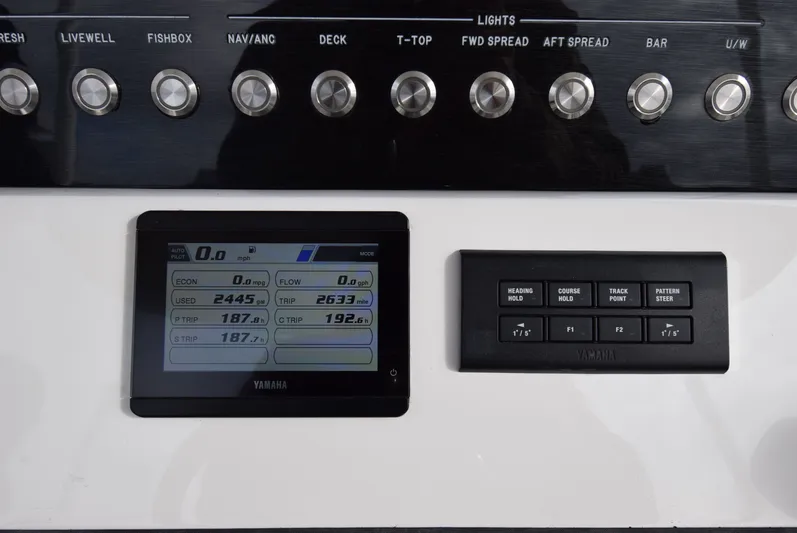 Shore Runner Yacht Photos Pics Control panel of a 2021 Regulator 34 boat with Yamaha display and buttons.