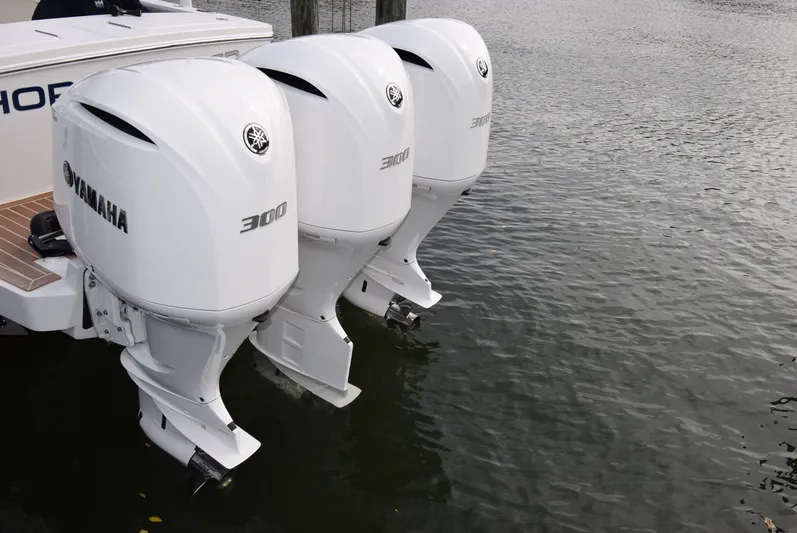 Shore Runner Yacht Photos Pics Triple Yamaha 300 outboard engines on a 2021 Regulator 34 boat, docked on water.
