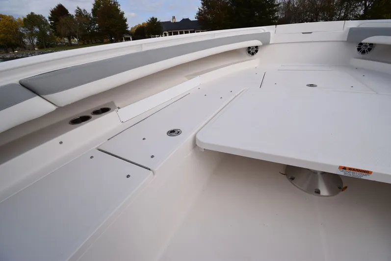 Shore Runner Yacht Photos Pics 2021 Regulator 34 boat interior with seating and storage compartments.