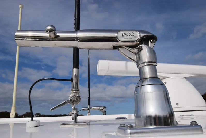 Shore Runner Yacht Photos Pics Chrome boat accessory on 2021 Regulator 34 against blue sky.